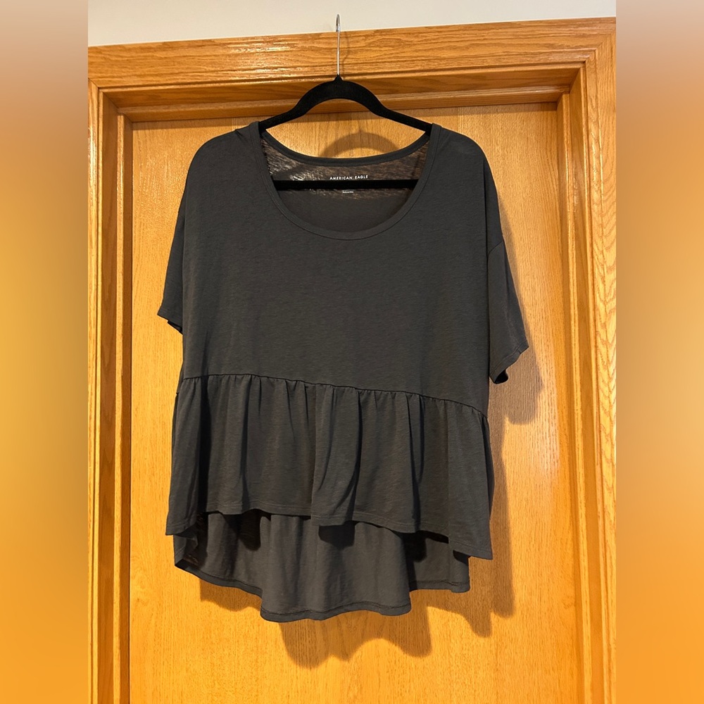 Ladies size large, American Eagle Dark Gray Ruffle Hem Top. NWOT